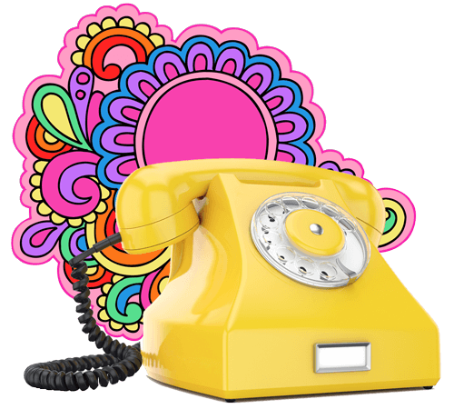 Old style 1940s phone in yellow with flower power design behind it.